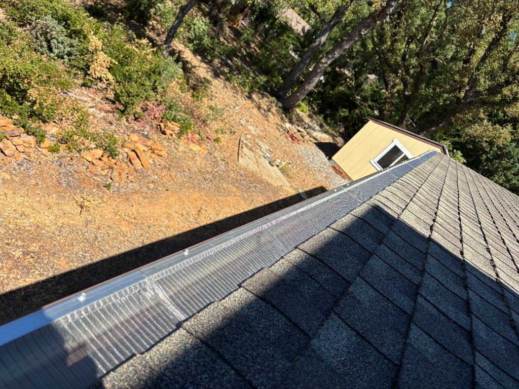 Close-up of installed Gutterglove stainless steel micro-mesh gutter guard