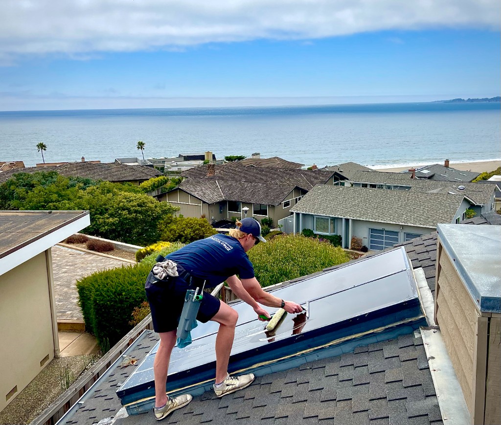Solar panel cleaning with Santa Cruz ocean view