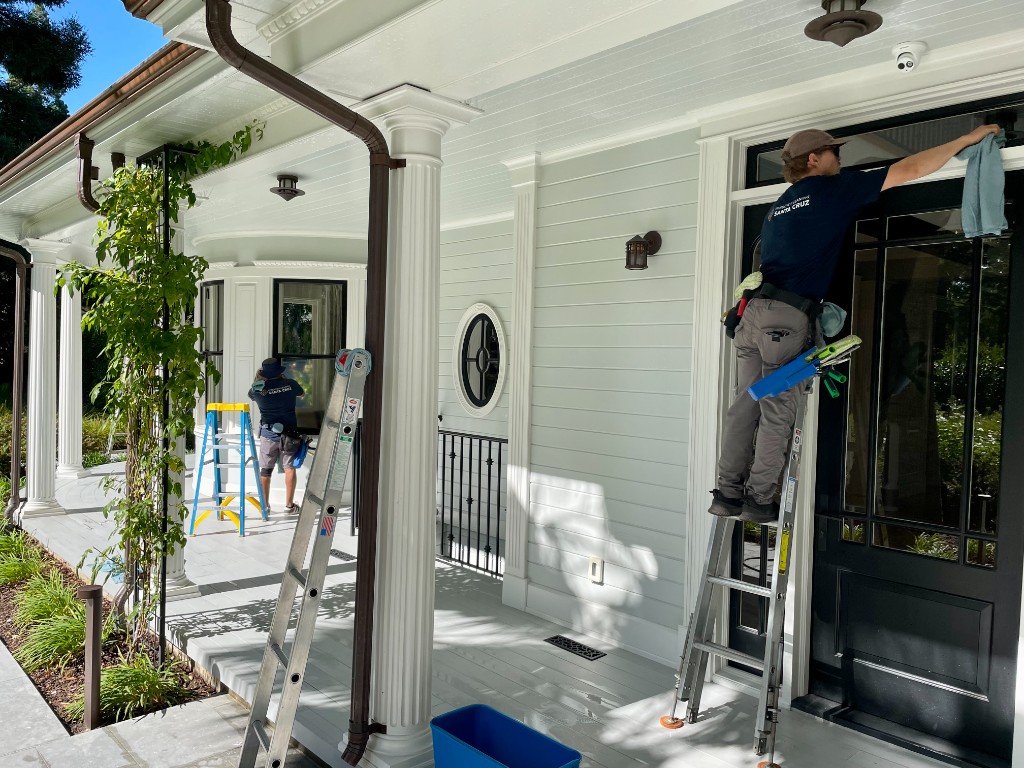 Window Cleaning Santa Cruz team cleaning windows on a beautiful home