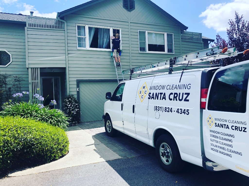 Window Cleaning Santa Cruz van and technician on ladder cleaning residential windows