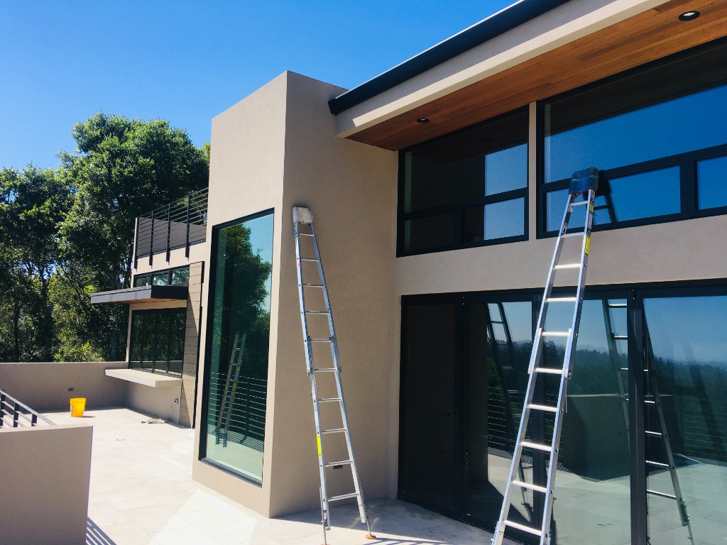 Professional Window Cleaning Setup on Modern Home