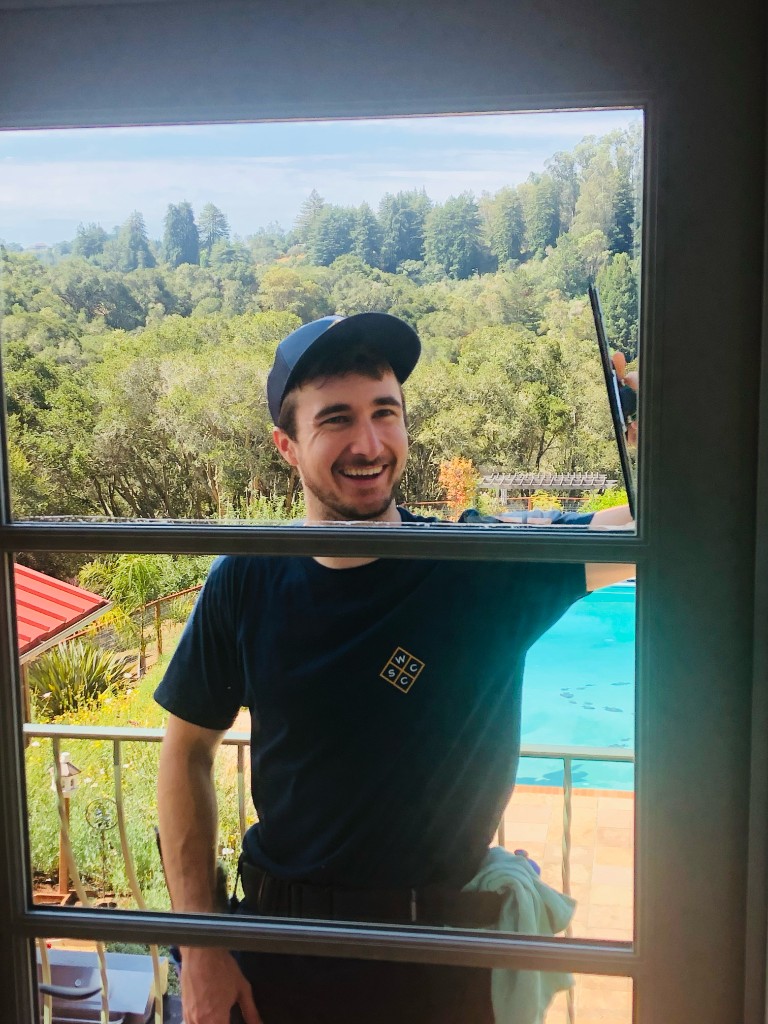 WCSC crew member cleaning windows in Santa Cruz
