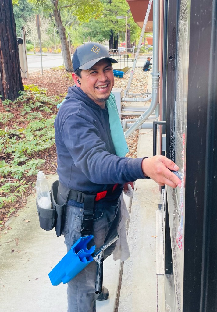 WCSC crew member cleaning windows with professional equipment